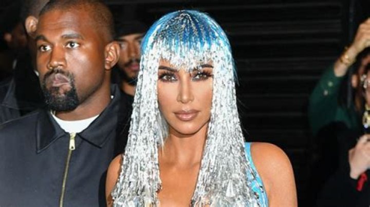 Kim Kardashian Channels Cher With Plunging Latex Dress & Fringe Headpiece At Met Gala After-Party